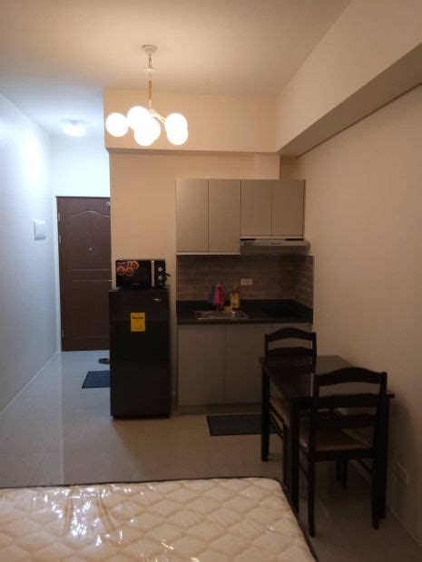 amorsolo tower|Studio unit with parking for sale at The Beacon.